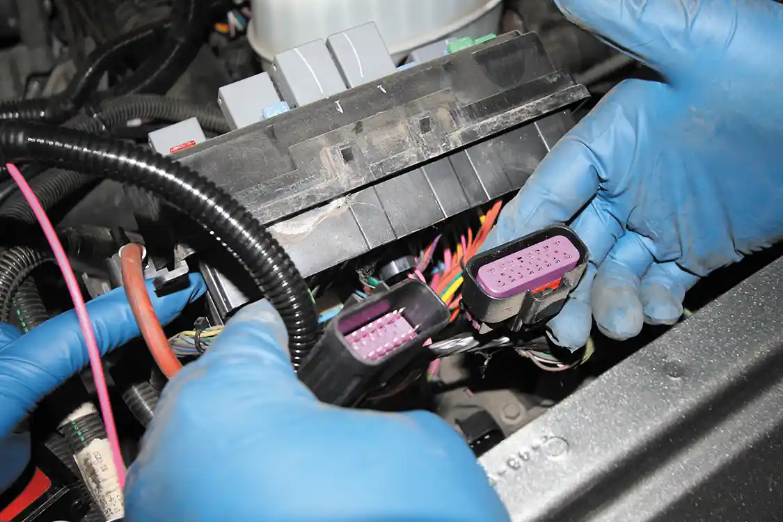 7. Underneath the fuse panel, you’ll find this OEM connector. The Banks harness will need to be plugged inline.