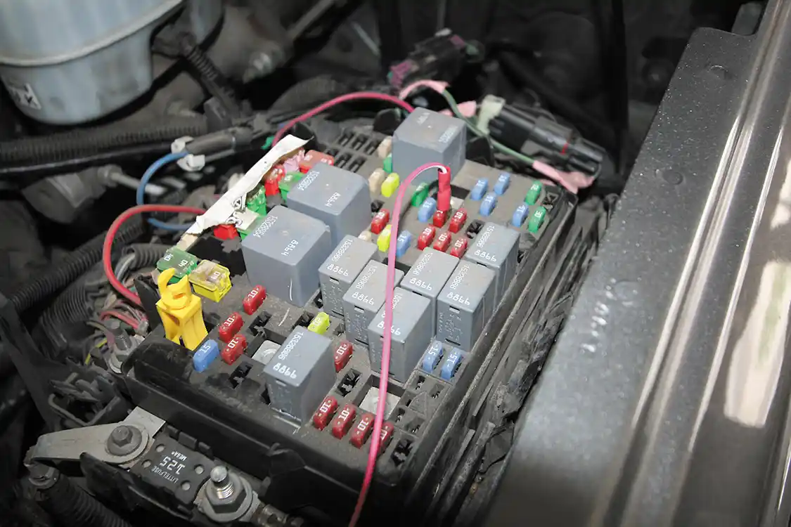 10. Banks makes it easy to tap the appropriate wires in the fuse box with the supplied wiretaps and clearly marked instructions. After the appropriate wires are tapped, simply slide the fuse-box cover back on.