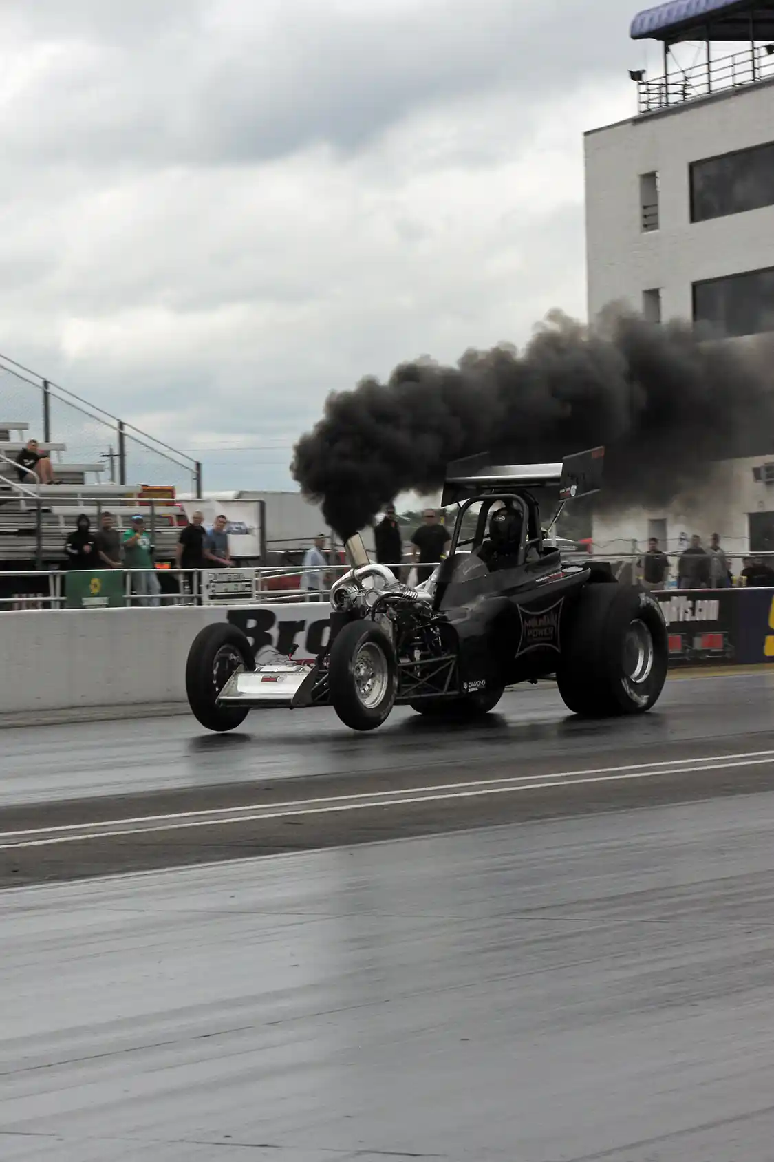 Aaron Reynolds lifts the front tires off the track as he blasts down the 1320 to take the win in the Pro Mod Class with his Cummins-powered ’23 Altered.