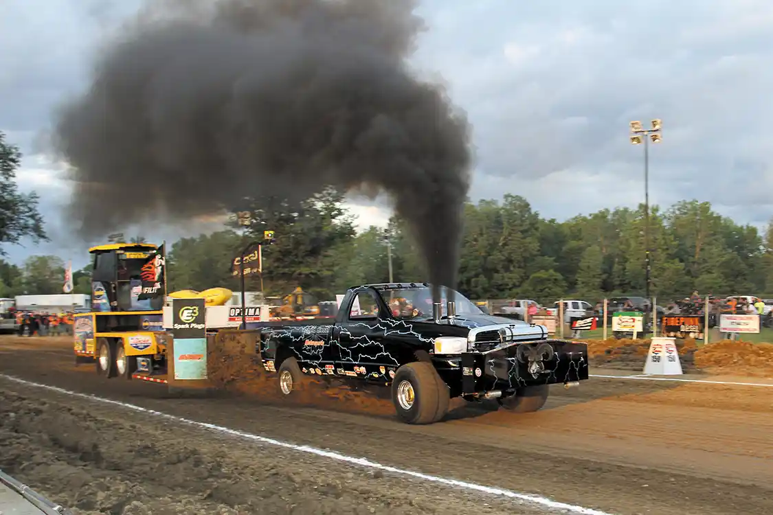 Kent Crowder drove the Scheid Diesel Dodge to the win in the Super Stock Class pulling during one of the brief sunbreaks we got through the evening.
