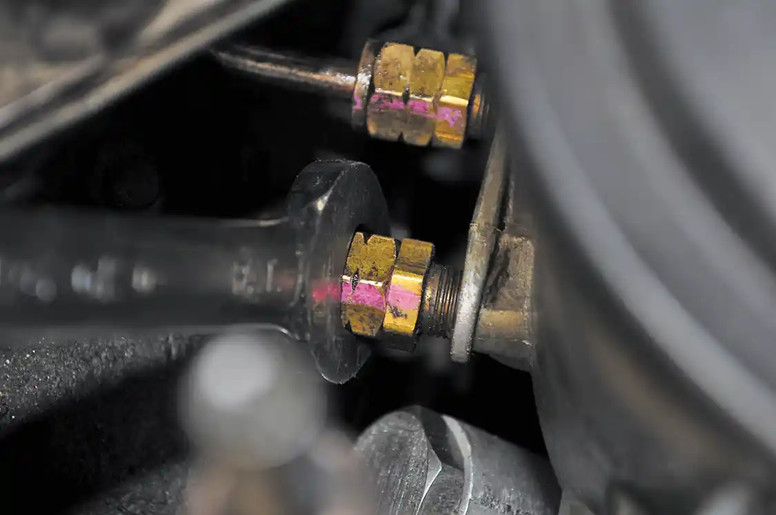 3A/3B. The fuel filter housing sits atop the HPOP, so removing it came next. Attached to it are two fuel supply lines to the head that feed the injectors, a supply from the tank, a regulated return back to the tank, and a line to the filter housing drain valve. After removing the lines, the two bolts securing the housing to the HPOP reservoir were pulled and the assembly was then taken off the engine.