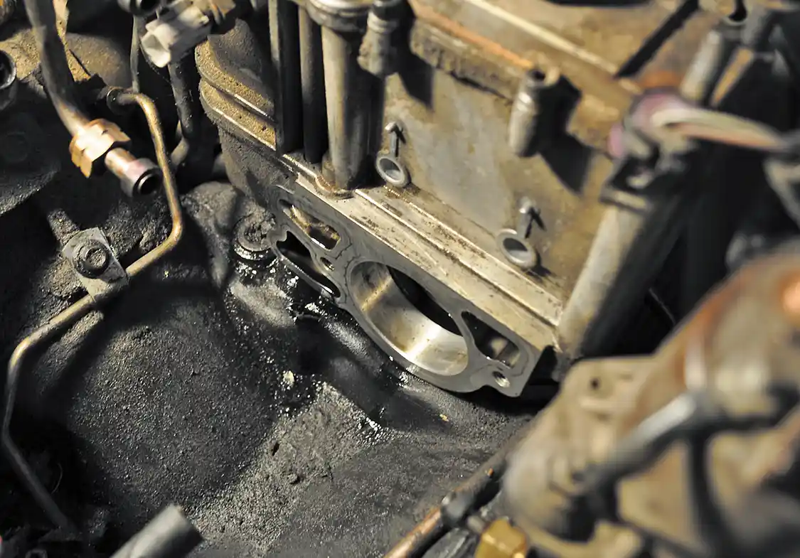 8. Before removing the HPOP, we cleaned around it, making sure any contaminants (sand, old oil, etc.) would not fall into the front cover and later wreak havoc on the engine.