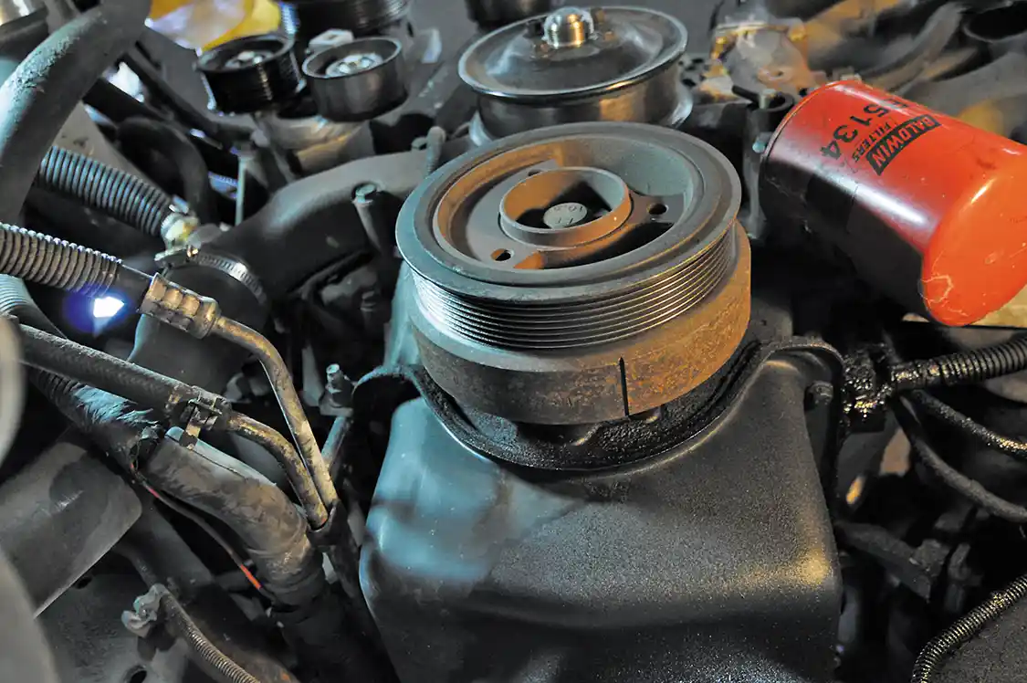 2. The LPOP runs off the crankshaft and is located behind the harmonic balancer, so the first step is getting it out of the way.