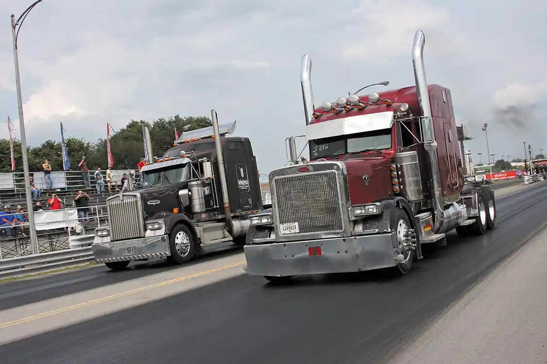 Rob Patterson (near lane) drove his <a href="https://www.peterbilt.com/">Peterbilt</a> semi to the Big Rig Class win on Saturday and Sunday.