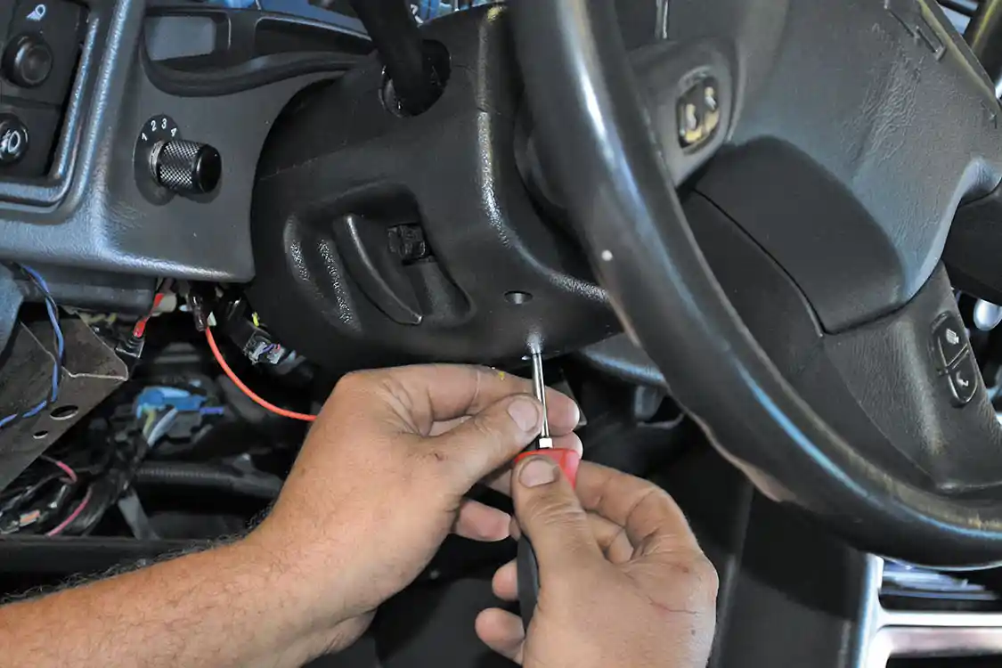 3. To gain access to the shifter, the steering column cover must be removed. When doing this step, take extra care not to break the clips on these covers. Only slight force is needed.