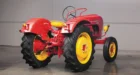 Though a rear three-point hydraulic lift was technically optional, it was so common in the U.S. imports that you could say “every one” had it. This one is missing its lower arms and links but has the adjustable hitch. For the Standard, the lift was a Class II and rated for about 2,800 lbs. The specs say this tractor was rated for a 2-14 mouldboard plow. When you look at specs for the four Porsche-Diesel tractor models, the plow rating is tied directly to the number of engine cylinders, in this case: two bottom for two cylinders. The hoop-like device on the rear fender is the passenger seating area. Not comfortable, but secure.
