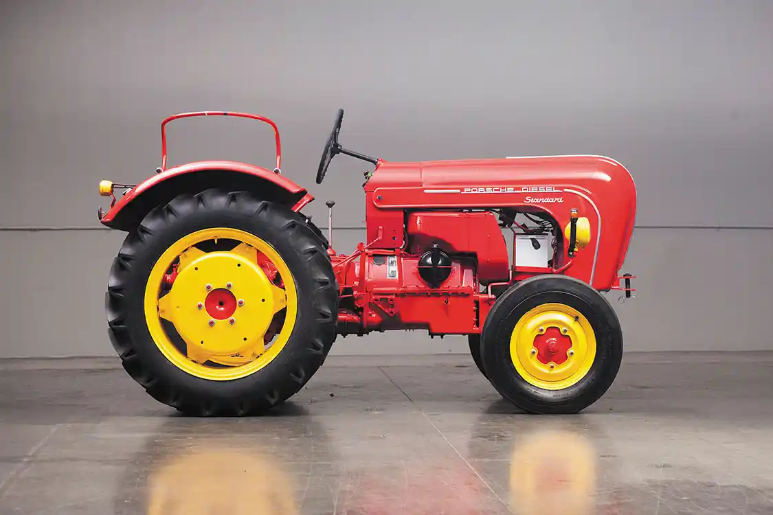 The Porsche-Diesel Standard isn’t a big tractor but was designed to be versatile. It was an adjustable tread tractor, with a wheel track spacing adjustable from 49 to 73 inches. If the front wheels look familiar, think Volkswagen. The tractor used a five speed manual from <a href="https://www.zf.com/products/en/cars/home/cars.html">ZF</a> and had reduction gears in a portal style final drive. One of the unique features in the Porsche-Diesel tractor was a hydraulic coupling. It operated much like a torque converter, and you only needed the foot clutch for gear changes. The hydraulic coupling provided a load-sensing device that worked as an automatic torque amplifier. Wheel weights were available, but we don’t have specs on what was the maximum amount for the Standard. They also used liquid in the tires.
