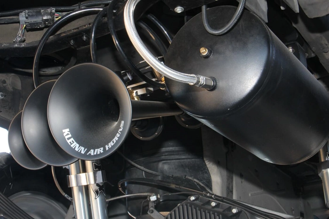 Here you see the triple <a href="https://kleinn.com/">Kleinn</a> air horns and the air tank that feeds them. Because really, would a truck like this have a wimpy horn?