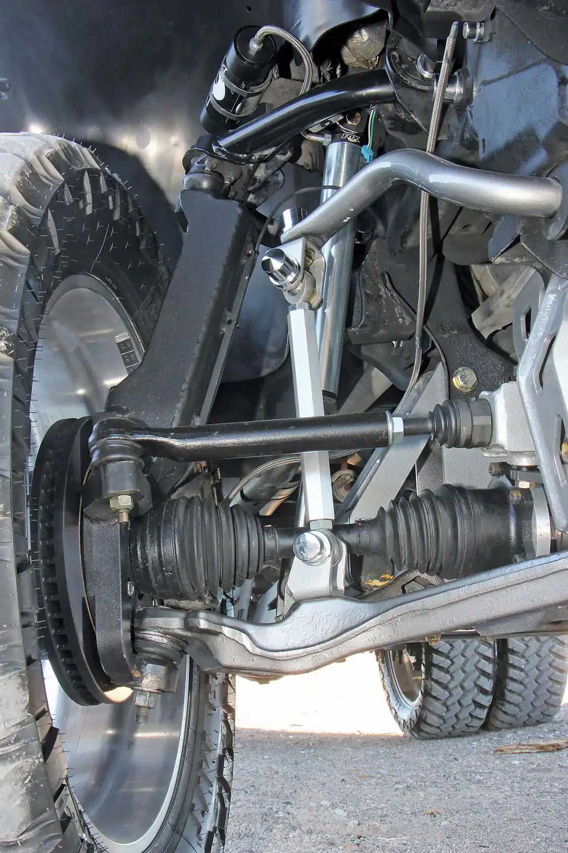 Here you can see the tubular upper control arm drop-down and the Fox 2.0 remote-reservoir shock setup that controls this truck’s motion.