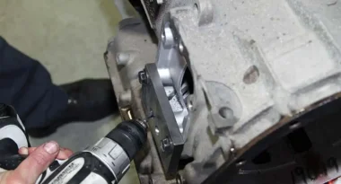 8 / 9. Once everything is removed from the main Allison case, Delo mounts the Goerend jig to drill fluid passages to provide additional lubrication and cooling to the C-3 clutch pack with the Goerend cast aluminum PTO covers. The hole is drilled at a precise angle to channel the fluid directly to the C-3 clutch pack.
