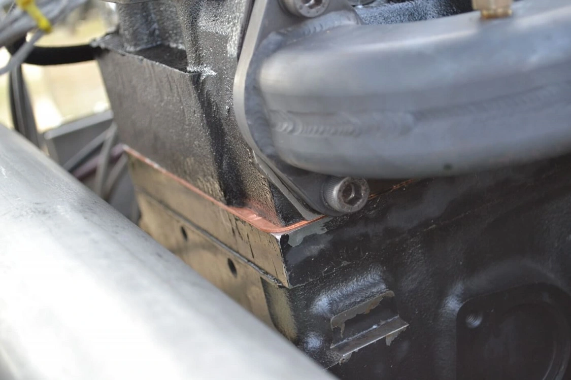 Part of the reason that the engine is so strong is because of Haisley Machine's "Super B" recipe. Although the engine is based on a 6.7L Cummins block, it has a number of serious modifications, including a deck plate (arrow), and a sleeved and filled block.