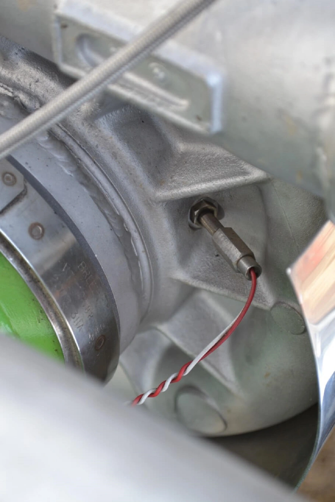 With turbos as expensive as these, you don't want to overspeed them. Matt keeps track of impeller speed through his data logging system, and through this sensor that's located on the front compressor cover of the turbos.