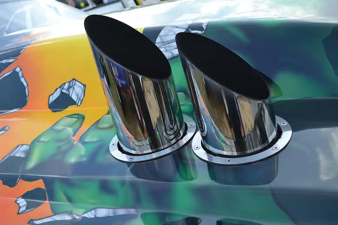 On a sled puller of this nature, exhaust is kept short and simple. Twin 6-inch <a href="http://www.grpipes.com/home">Grand Rock</a> stacks exit right next to the cowl hood on the GTS body.