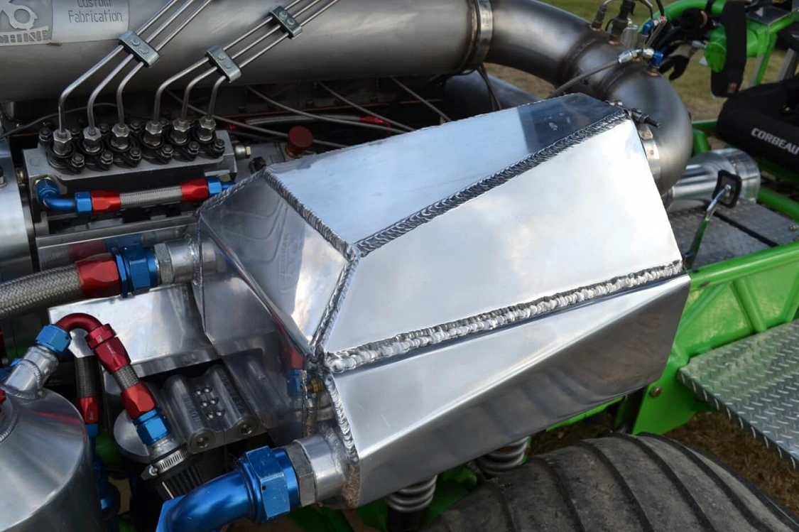 An enormous air-to-water intercooler was built in house by Rod Wilson at AEDM, and chills the 500-plus degree turbo-out air to under 100 degrees. V-bands are the only connection that can survive under this type of pressure.