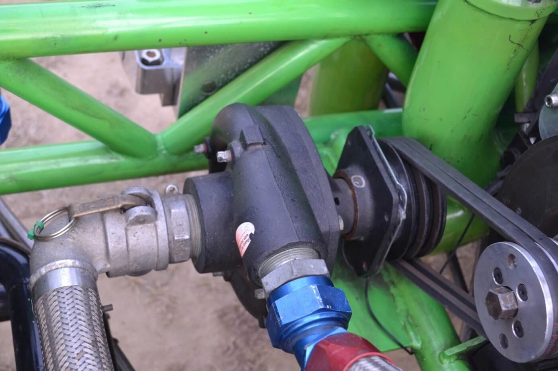 The pump that looks like a small belt-driven turbocharger is used to recirculate ice water through the intercooler. The truck melts more than 100 lbs. of ice per pass!