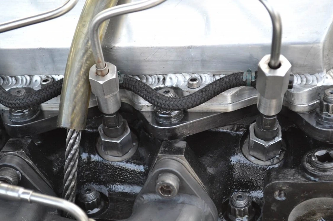 Oversize injection pump lines and DT466-based International injectors round out the engine's fuel system. The enormous injectors are used not only in order to make power, but also to drive the turbine side of the huge triple turbochargers.