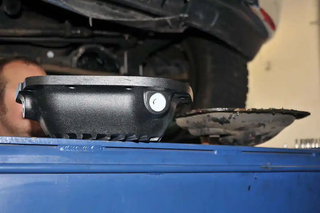 10. Here’s a good look at how much bigger the PML pan is in comparison to the factory front diff pan.