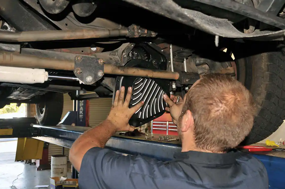 12. It’s a bit of a tight fit with the steering arm in front of the differential, but it can be done. Again, the hardware is supplied by PML and there’s no room for a power wrench here.