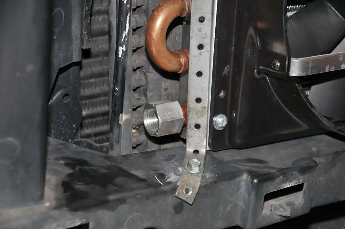 16. The straps used to mount the cooler aren’t exactly pretty, but they are very effective and can’t be seen once the grille is back on.