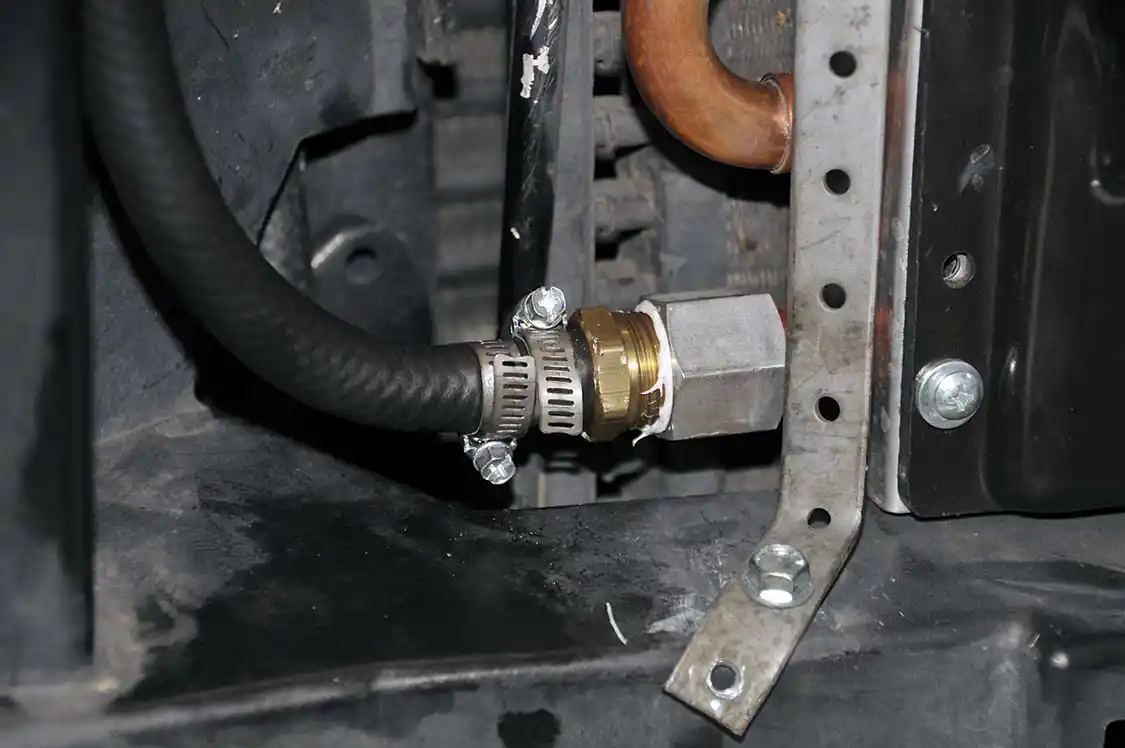20. Cory ran two hose clamps on each end and he put them in opposite positions. Here’s the fitting all tightened down. This connection is never going to leak.