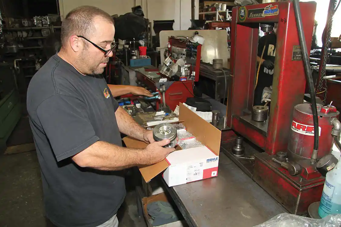 11. Derek Ranney, manager and co-owner of L&amp;R Automotive, inspects the new <a href="http://www.us.mahle.com/en/">MAHLE</a> pistons before they’re installed in our 7.3L Ford diesel. L&amp;R has been in business for 38 years and supplies engine parts as well as top quality machine work for all types of engines.