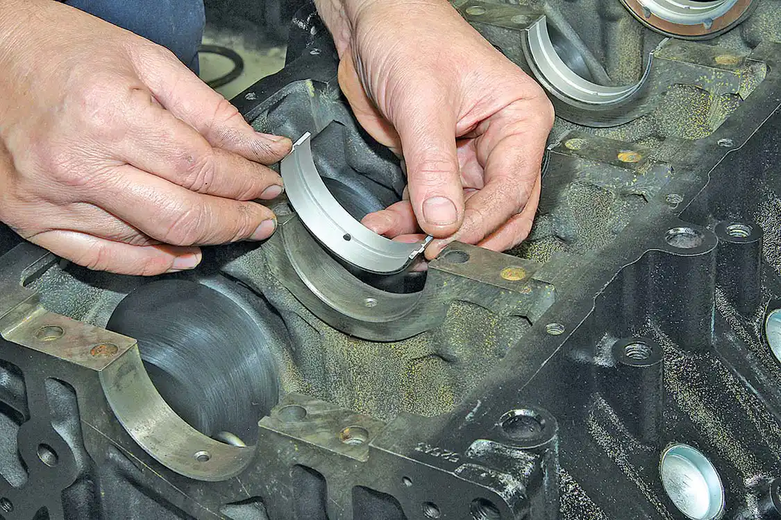 15. Here you see the crank bearings being installed in the block. These bearings and the crank journals must have a tight fit to maintain engine oil pressure. L&amp;R ensures your motor goes together with the proper bearing clearance for the application and intended use. Be sure to use assembly lube if you’re installing the crank yourself.