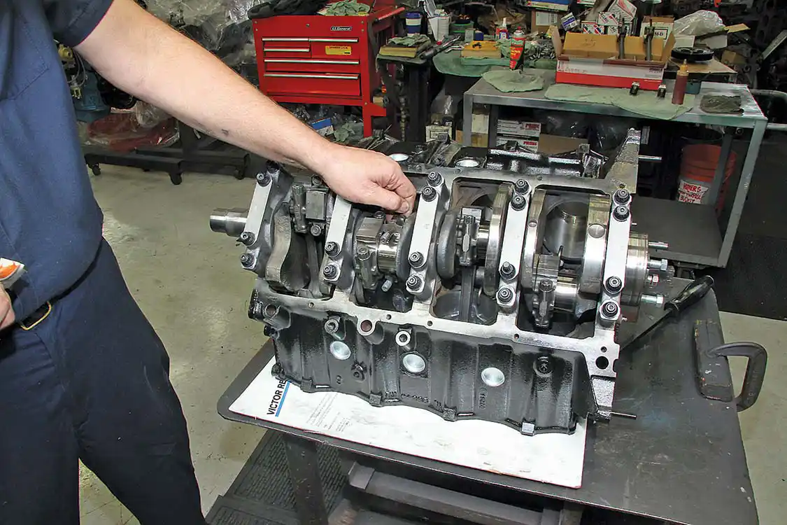21. With the piston and rod assemblies in place, the rod caps can be installed and torqued to spec. Again, this is done one bank at a time.