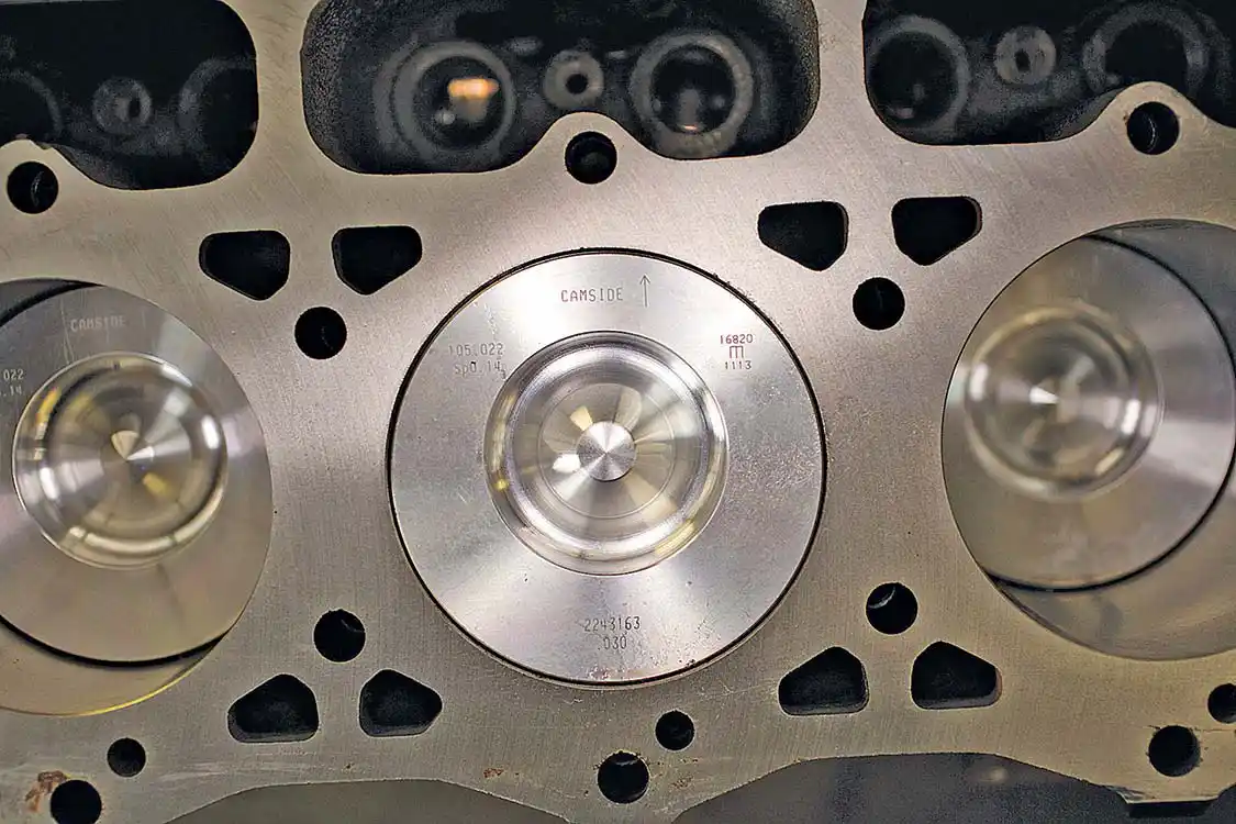 22. Here you see the pistons installed, note that the dome is not on center and that the pistons are marked as to which side faces the cam.