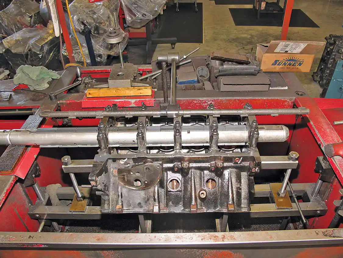 6. The crankshaft of the engine is the main rotating part. It rides on bearings that are supposed to take the stress and wear as the engine run. Unless you have an engine with a spun main bearing, a simple, light-touch line hone operation for the mains should be all your engine needs. If not, a line boring will clean up the crank journals. Here you see a line hone operation being performed by L&amp;R on our 7.3L Ford block.