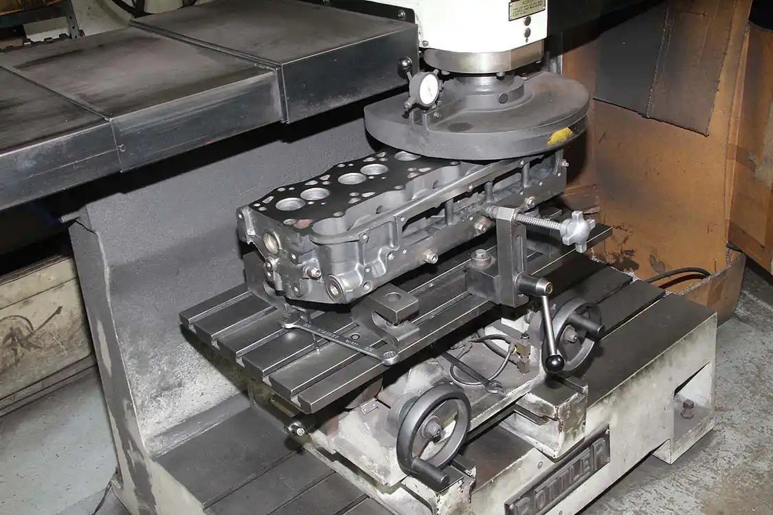 7. L&amp;R also services the heads for the 7.3L Ford refresh. First, the heads are stripped and cleaned. Then they are surfaced, as you see being done here. Surfacing the heads ensures a flat surface and a good seal of the head gasket.