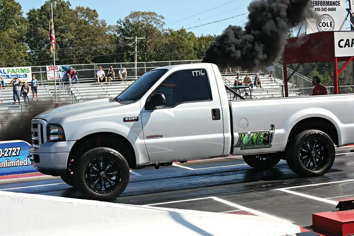 With both event hosts, Maryland Performance and Innovative Diesel, being known for their vast knowledge of the <a href="https://www.ford.com/">Ford</a> <a href="https://www.powerstrokediesel.com/">Power Stroke</a>, it was no surprise to see a huge turnout from the Blue Oval crowd. This 2005 F-250 was originally built by Innovative Diesel, but has since been sold to a local customer. The custom-fabricated triple turbochargers under the hood definitely help get this little hot rod from Point A to Point B in a hurry.