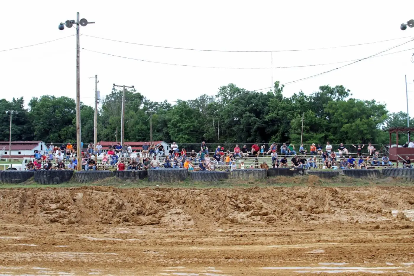 Despite rain overnight and earlier in the day, a decent-sized crowd turned out for the first sled pull hosted at a RRE event. Even after hours of track work, much of the infield was not at all usable for pulling as can be clearly seen by the abundance of mud adjacent to the pulling track.