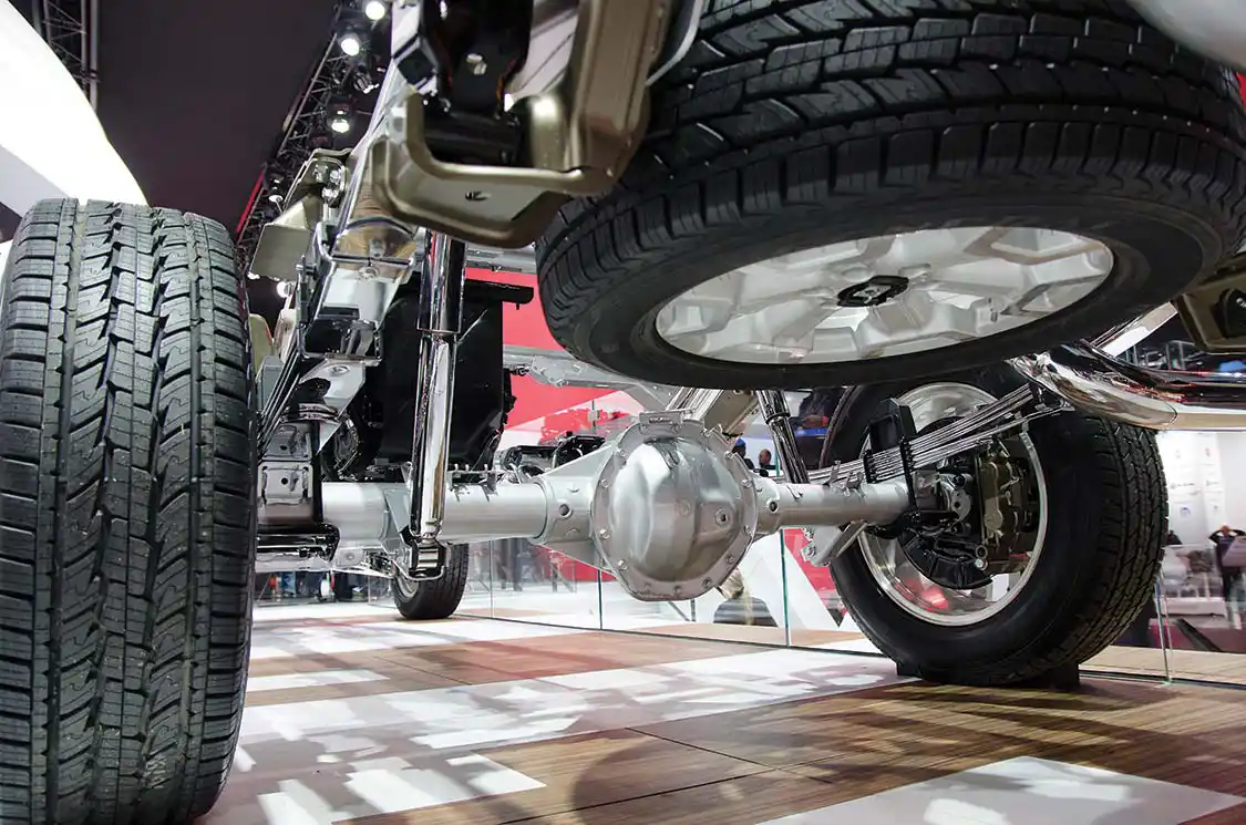 Underneath, it’s clean. Where others drop the springs below, Nissan keeps them above for ground clearance. We’ll have to dig deeper about why no IRS. Maybe it’s because it’s a mini-HD?