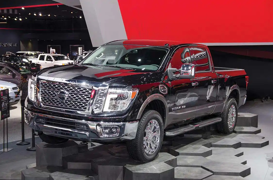 Ooh, shiny indeed. That’s a load of chrome up front. Note the projector headlamps and hockey stick LED DRLs. Chrome bumpers have faired-in fogs that seem part of the headlight stack. Frankly, the front end is becoming more appealing the more we look.