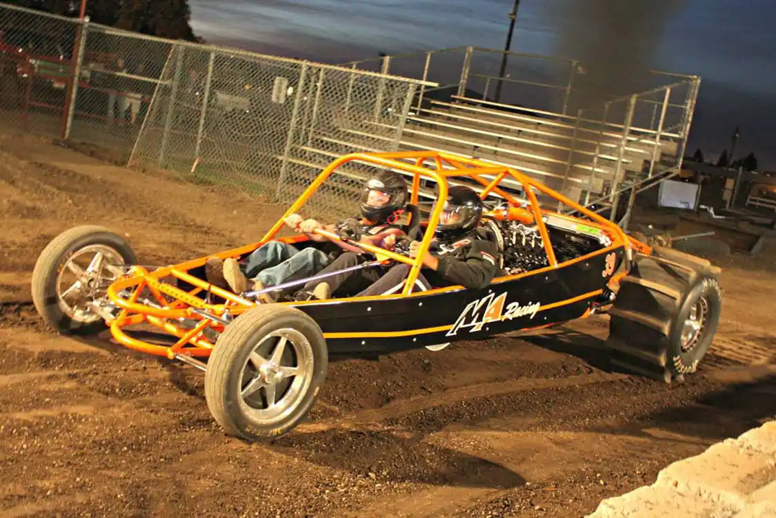Making the haul clear out from Michigan, Eric Merchant of Merchant Automotive brought their custom Duramax-powered “Sand Rail Buggy” to show off during the day and make a few passes down the dirt drag track. Running a fully built LBZ motor with 100 percent injectors, 10mm CP3 pump, <a href="https://www.danvilleperformance.com/">Danville</a> 72mm VGT turbo and backed with a Power Glide transmission it should be in the 700-hp range, which is more than enough to set you back in the seat.
