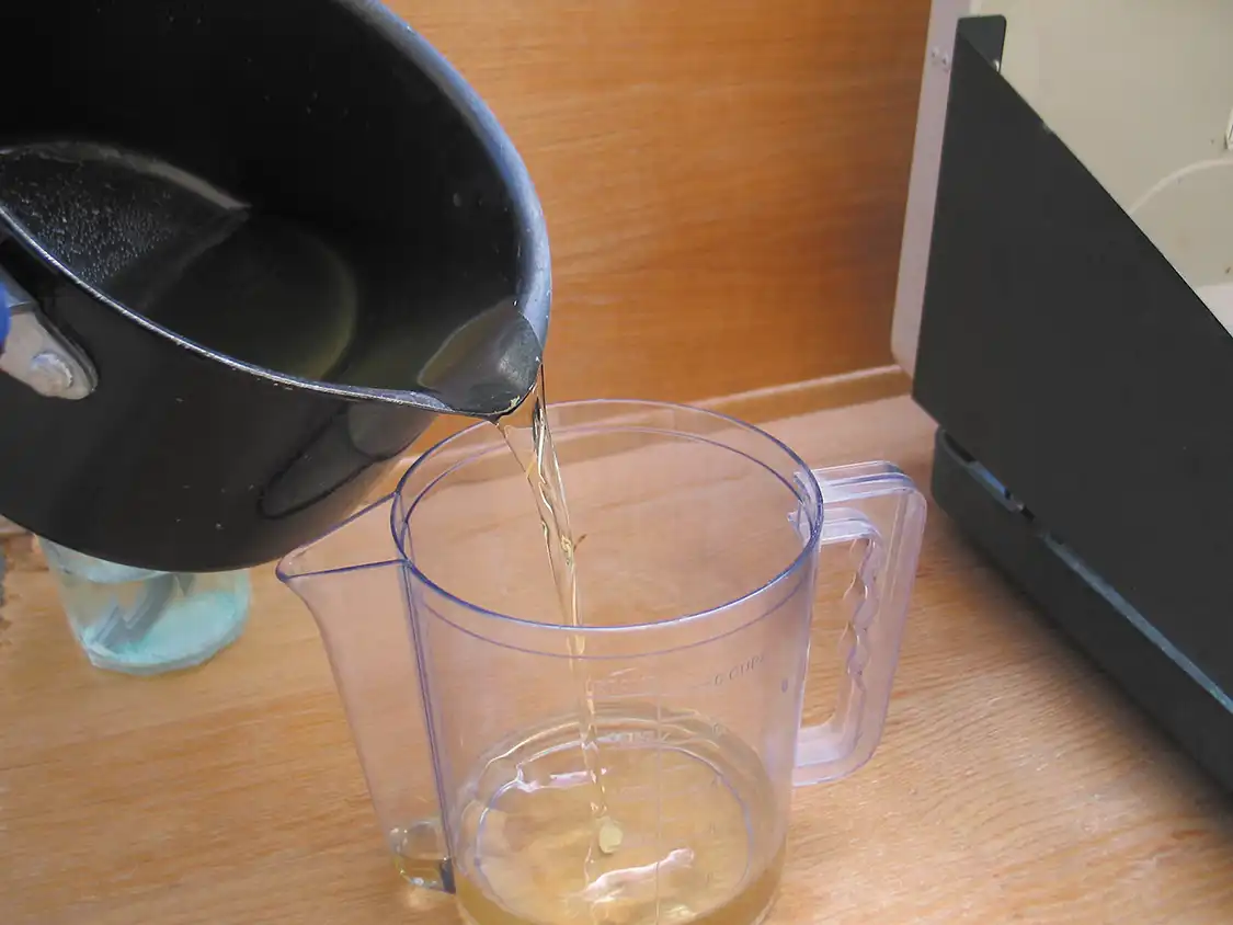 5. Once the oil reaches 130 to 140 degrees Fahrenheit, funnel it into the two-liter plastic bottle. In our case, we used a 1.5-liter gravy strainer because it’s plastic and pours from the bottom. Note: Let the oil cool down slightly if it surpasses 140 degrees so you don’t melt the plastic.