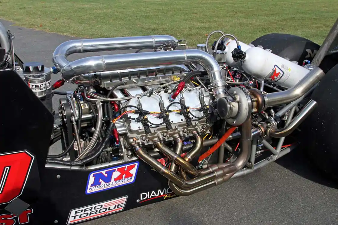 The 400 cid parallel twin turbocharged Duramax is the heart of the beast making an estimate 2,100 HP. The equal length tube headers are a work of metal crafting art and a unique sight to see on a diesel engine.