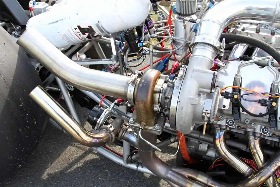 A BorgWarner EFR-series turbo charger that was modified by Industrial Injection is perched at the end header along with a Turbosmart wastegate.