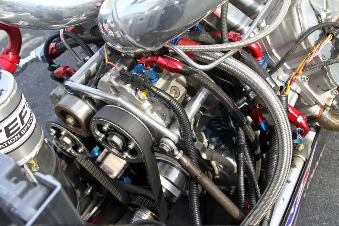 A pair of <a href="https://www.industrialinjection.com/">Industrial Injection</a> XP CP3 pumps are used to deliver all the fuel the Spitzer Duramax needs. Notice the cogged drive belt that ensures that there is no slip on the pulleys under heavy load and high RPM.