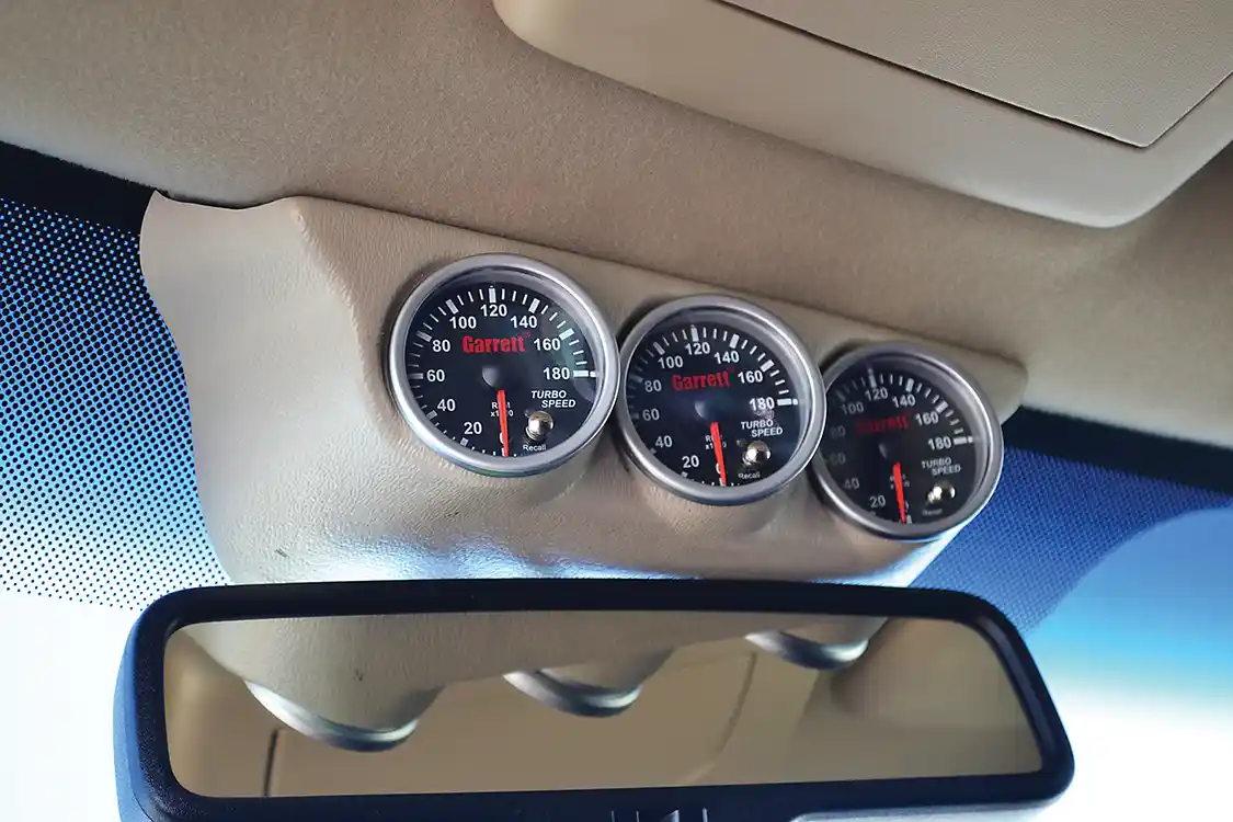 At one point, Erik even tried a triple turbo (98, into a 76, into a 62) setup on his Ford, which is why the odd combination of three turbo speed gauges can be found in the interior of the truck. After much tuning and testing, Erik found that the triple setup didn't perform that much better than a traditional compound arrangement, and he switched back.
