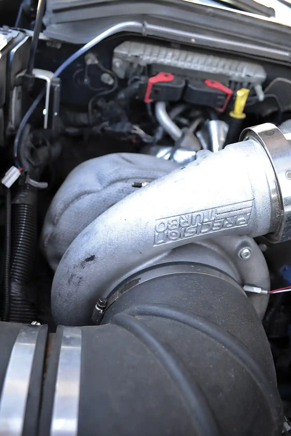 The key to the engine's awesome powerband was making the large 88mm Precision turbocharger do as much work as possible. During tuning on the dyno, it was discovered that the best power levels came with the large charger putting out as much as 40 to 45 psi to the smaller turbo (62mm-inducer VGT turbo from Elite Diesel).