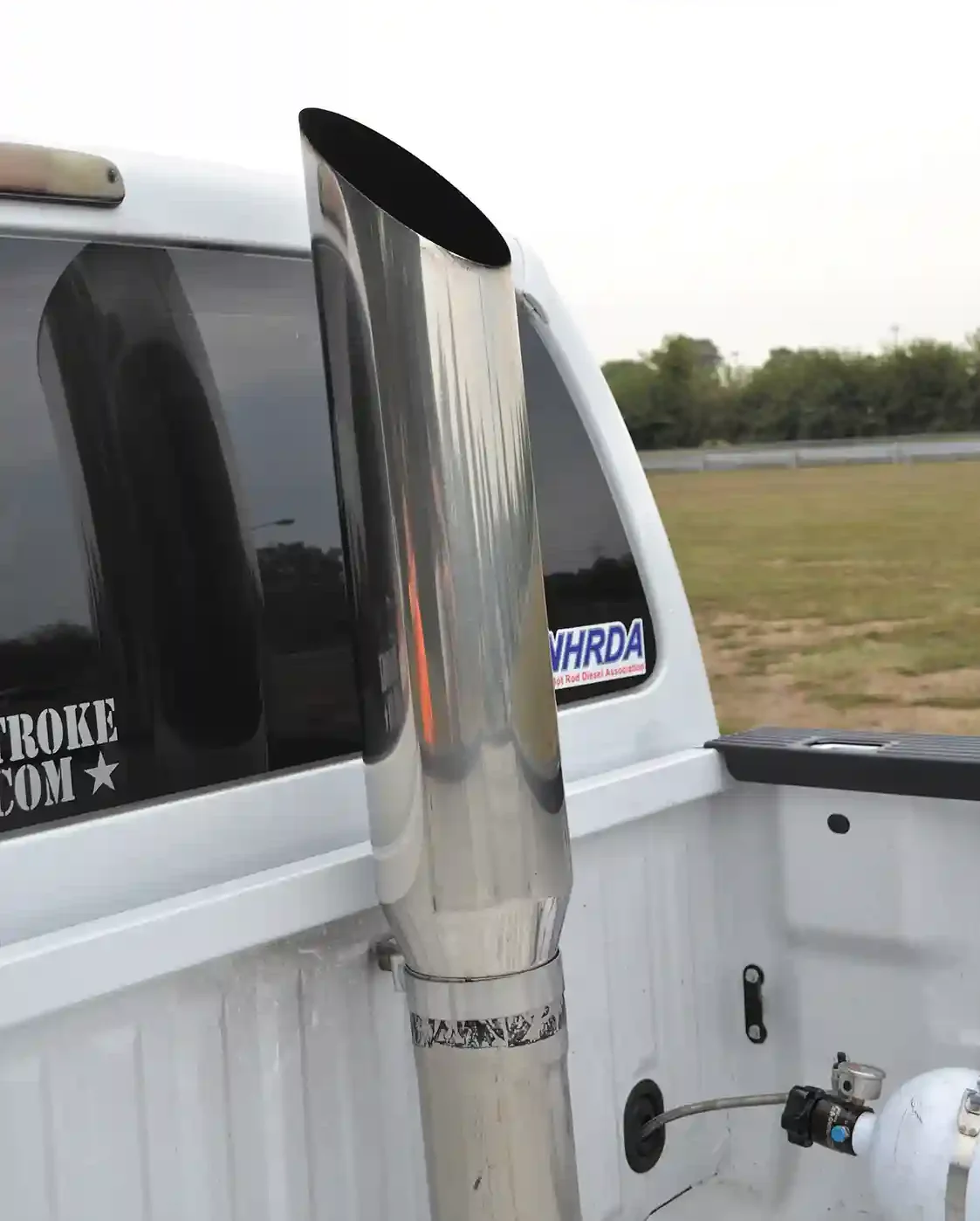 The downpipe from the upgraded turbo was fabricated by Morgan and sends exhaust back to a 5-inch exhaust and into a <a href="https://pypesexhaust.com/">Pypes</a> 5 to 7-inch stack.