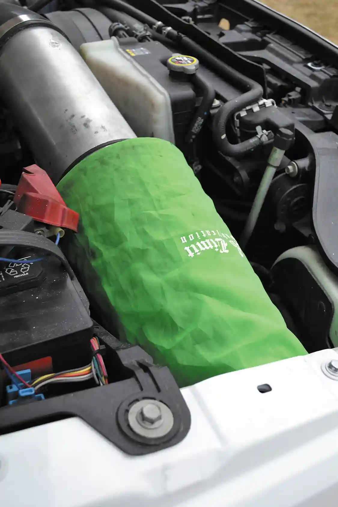 The build on the 6.7L started with an intake from no limit fabrication that flows a lot more air than the factory version. Since life as a shop truck can be difficult, a pre-filter was also included to filter out chunks of mud, dirt, and debris.