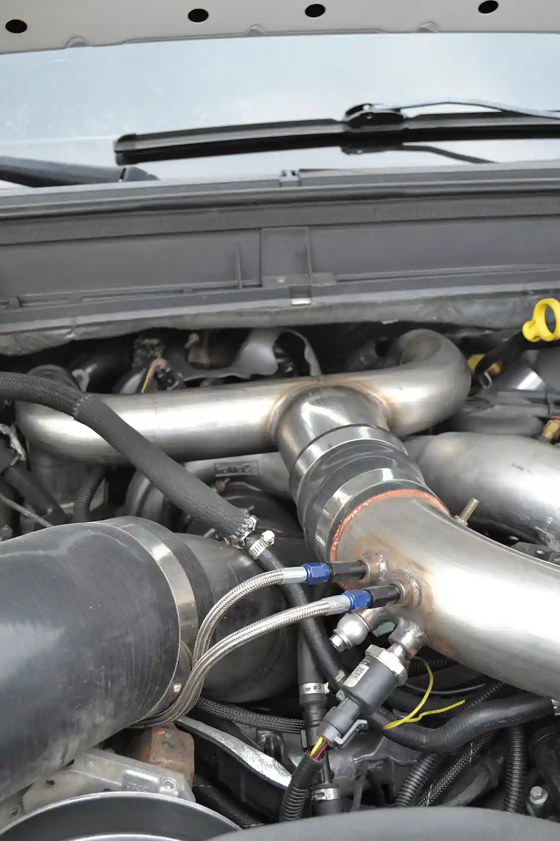 The drop-in theme continued with Morgan's build, as a variable geometry turbo featuring an upgraded 66mm compressor wheel and 70mm turbine (like the newer '15 models) was installed with Midwest Diesel's own piping kit.