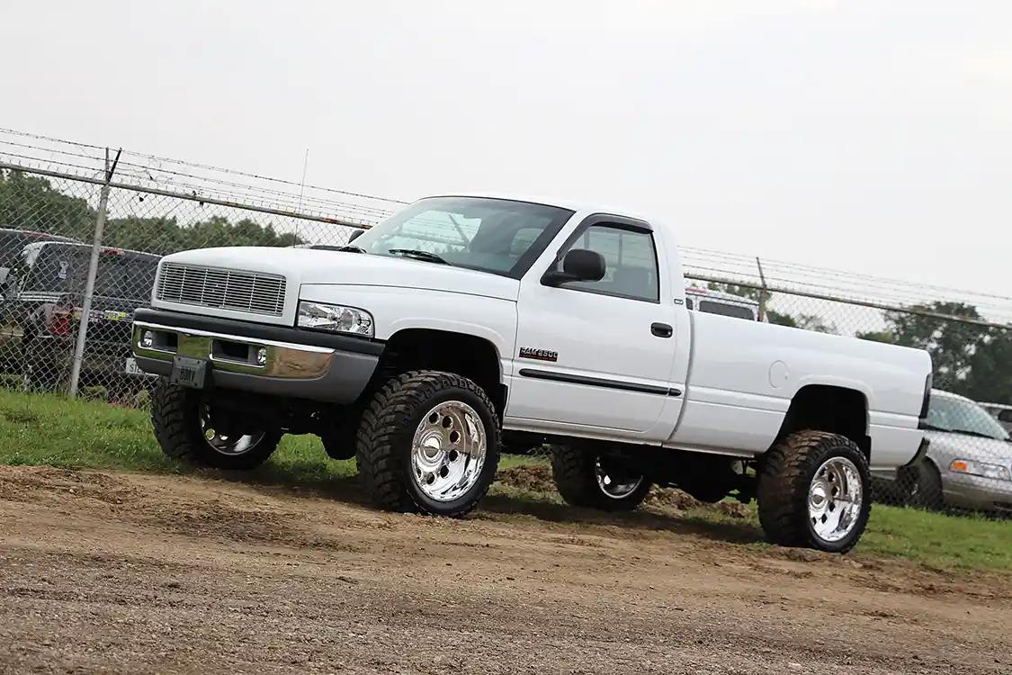 While browsing the pits, this uber-clean second generation <a href="https://www.cummins.com/">Cummins</a> owned by Brandon Davis stopped us dead in our tracks. To make a long story short, the truck is an ’01 HO model with the NV5600 and just 60,000 original miles. And being that he bought it out in Vegas, we believe him when he says it’s never seen rain. He parks it in a climate-controlled garage now that it lives in the Midwest.