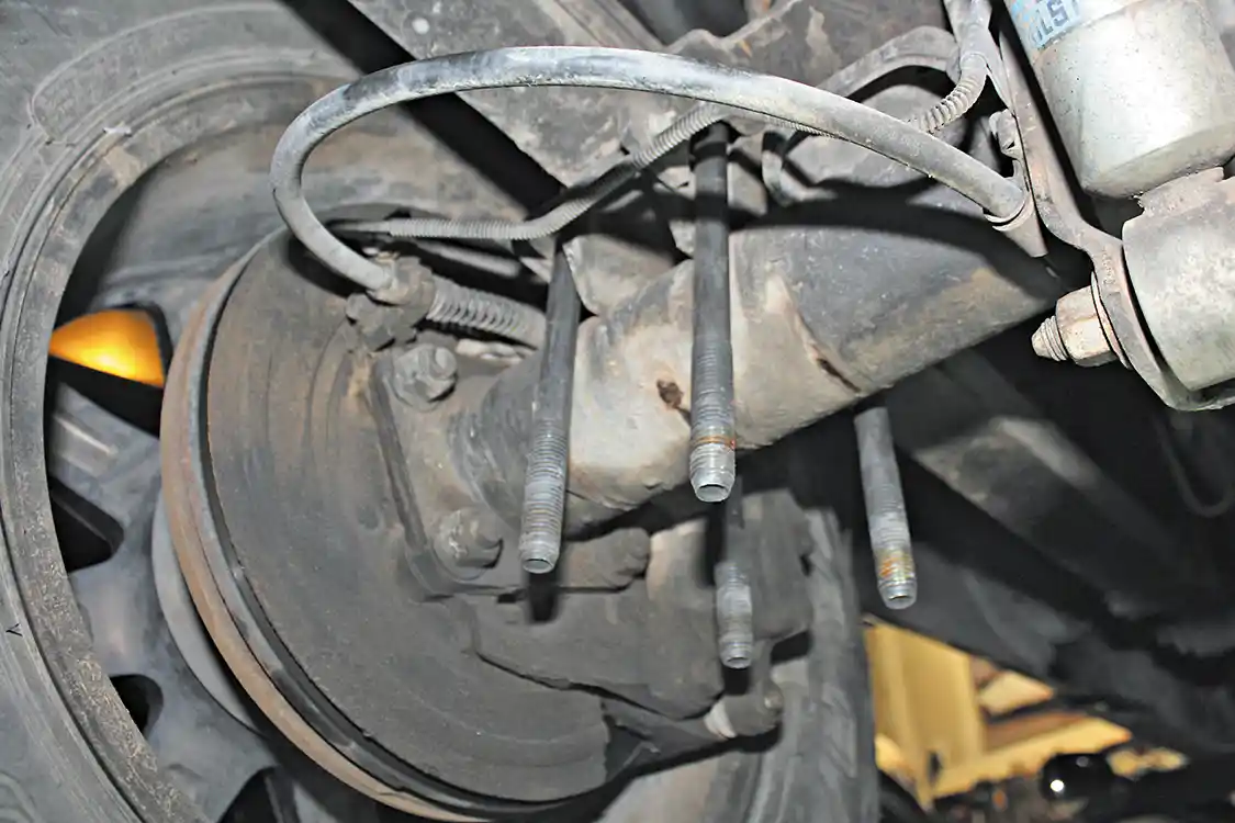 3. The first step to the install is removing the factory axle U-bolt nuts and washers. The Longhorn axle bracket will bolt-up using the factory U-bolts and hardware; you’ll simply slide the new bracket onto the U-bolts below the lower axle clamp plate.