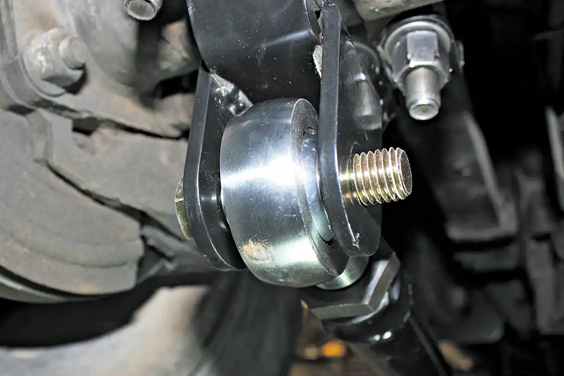 9. With the rod ends installed, the bards can be placed under the truck and the Grade 8 ¾-inch bolt slipped through the axle bracket and rod end holding the axle end of the bar in place. No need to tighten the bolt just yet, as the bars may come back out a couple times before final installation.