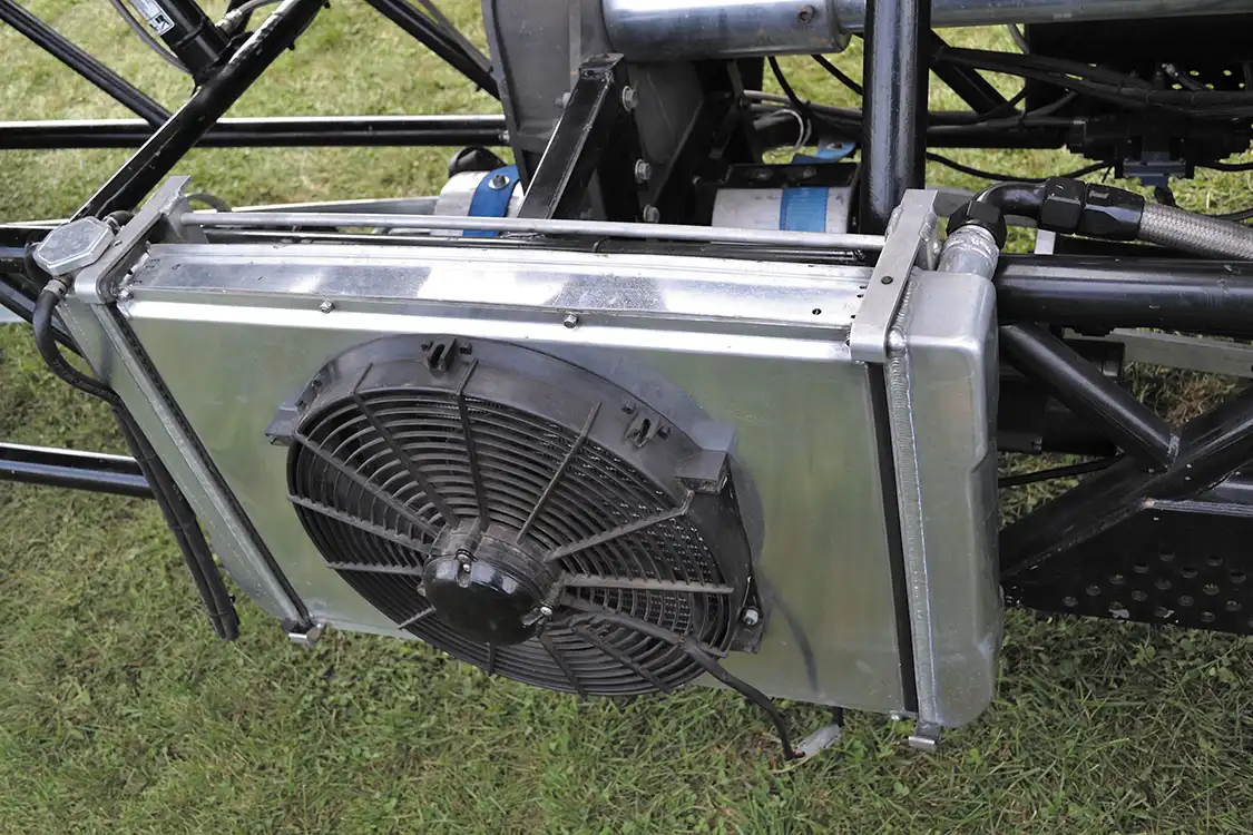 Although the block has been filled, Kyle still used a cooling system to circulate water through the heads. Since then, he's found the engine to be reliable without it, so the radiator has now been deleted.