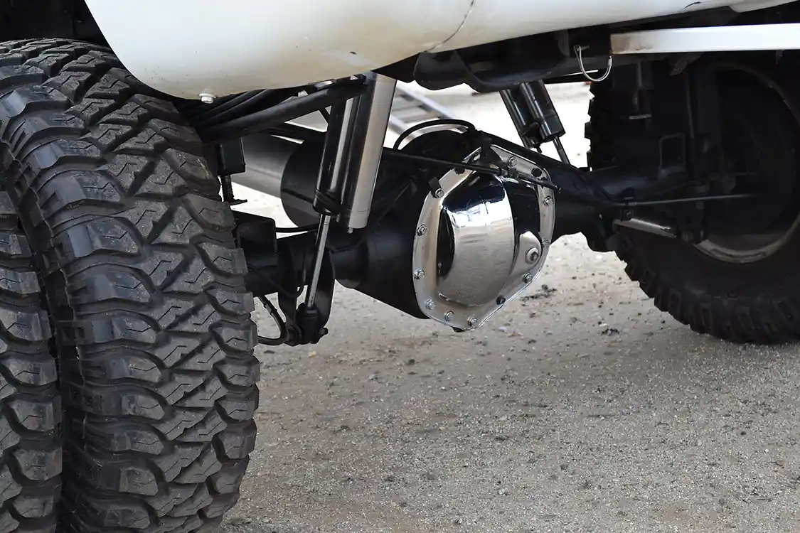 The rear-end of the truck has been upgraded with a set of stock-sized chromoly axle shafts after a series of broken axles. The locker in the 3.73 rear-end is so old that he doesn't even remember whom he purchased it from.