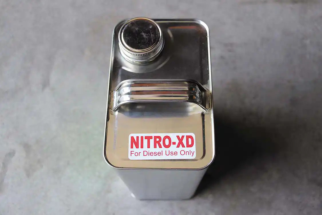 Made by Powermist Racing Fuels of Newton, New Jersey, Nitro-XD is a diesel-specific, oxygenating fuel additive. The unique chemical compound uses a proprietary combination of ethers to carry more oxygen into each cylinder. It’s an additive most people won’t tell you they’re running—because it works.<br />DW-1603-FUEL-06(insert photo and caption near this area of body text)<br /> For our testing purposes, we started with a 5% mixture of Nitro-XD, and then increased the ratio to 10%. Following our test, the makers of the additive told us that a lot of truck pullers run somewhere between a 20% to 25% mixture. For the most part, tractor pullers stick in the 15% to 20% range.
